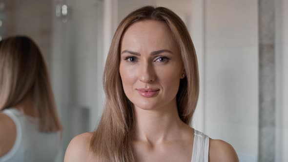 Close up portrait of young caucasian woman in the bathroom. Shot with RED helium camera in 8K.