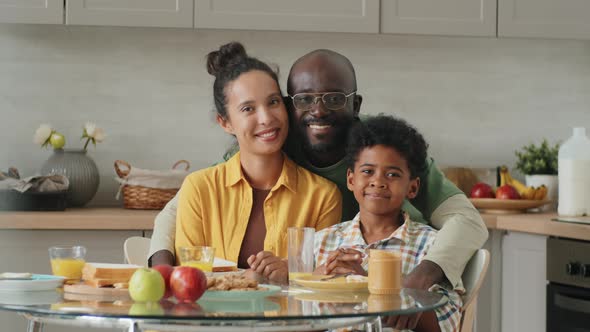 Portrait of Joyous Afro-American Family on Breakfast at Home