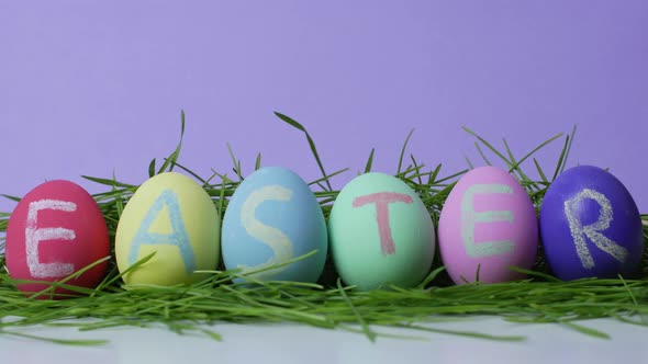 Stop motion video. Easter eggs on a changing multicolored background.