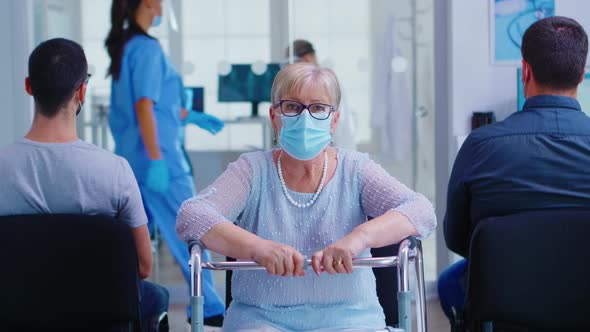 Portrait of Disabled Senior Woman with Walking Frame