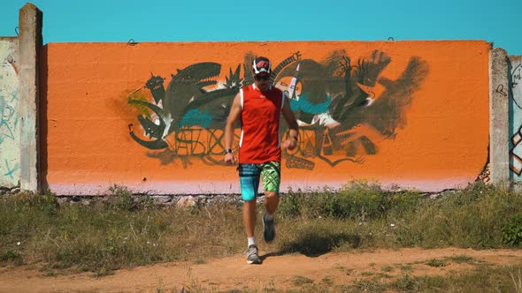 A Guy Dancing Against the Wall