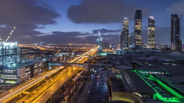 Aerial View of Financial Center Road Night to Day Timelapse with Under Construction Building