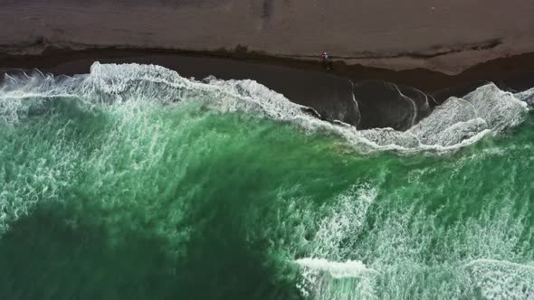 Aerial Top View of Beach with Black Sand