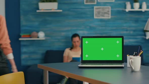 Laptop Computer with Mock Up Green Screen Chroma Key Standing on Desk