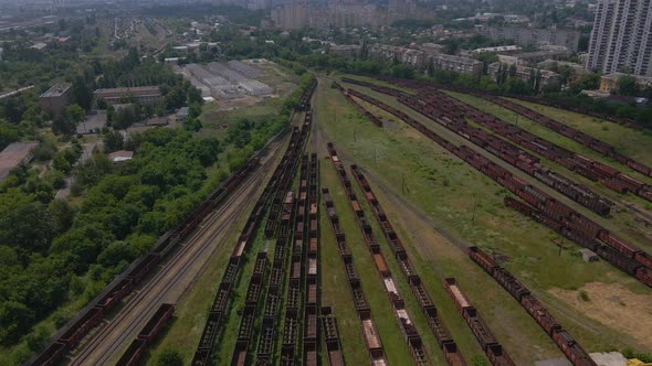 Aerial Footage of a Railroad Station with Many Junctions and Trailers
