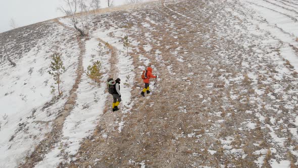 Aerial View of Two People on Winter Trekk