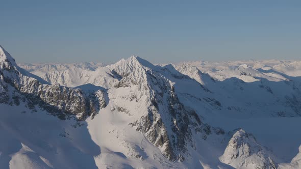 Aerial Panoramic View of Canadian Mountain Covered in Snow