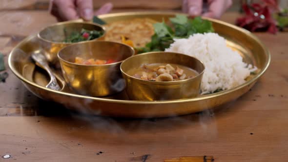 Spicy Chicken Tikka Masala in Bowl on Rustic Wooden Background. With Rice, Indian Naan Butter Bread