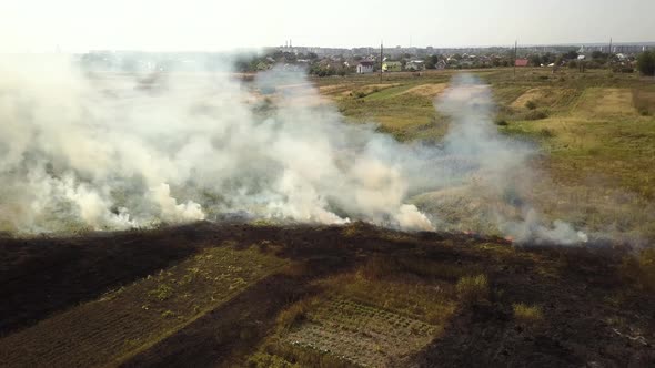 Aerial View of Burning Grass in Field