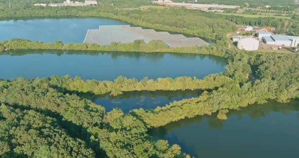 Panorama Aerial View of Floating Farm Solar Panels Cell Park Platform System on the Lake