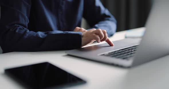 Female Using Touchscreen on Laptop