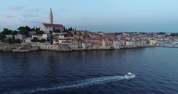 Aerial view of a boat sailing in the harbour in Rovinj, Croatia.