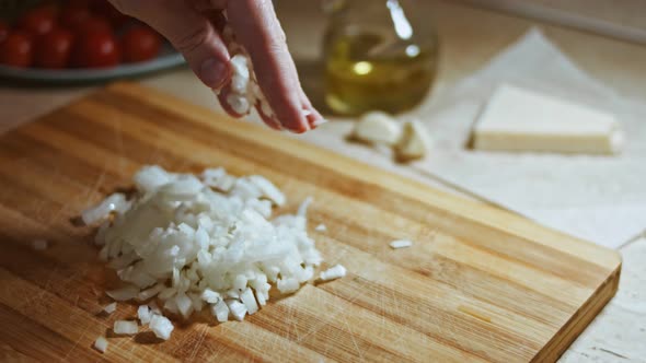 Chopping Onions Chef on a Wooden Board