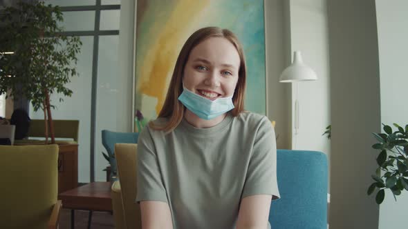 Happy Young Woman Making Facetime Video Chat Calling with Smartphone at Home Using Zoom Conference