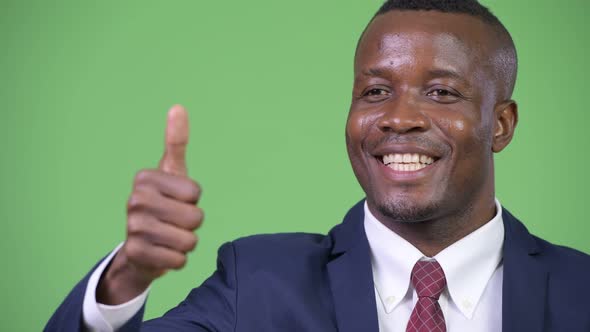 Young Happy African Businessman Giving Thumbs Up