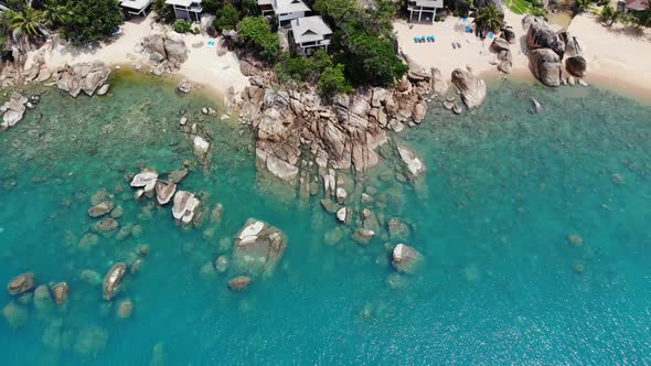 Small Houses on Tropical Island. Tiny Cozy Bungalows Located on Shore of Koh Samui Island Near Calm