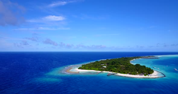 Natural birds eye travel shot of a white paradise beach and aqua blue ocean background