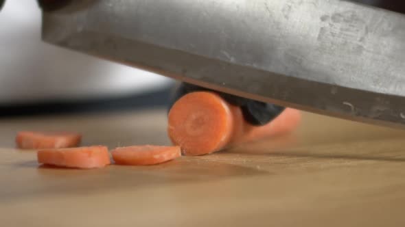 Chef slices a carrot, Apple ProRes slow-mo