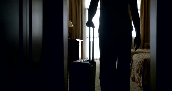 Adult Traveler Woman Is Entering Inside Room of Hotel, Putting Her Bag, Looking at Mirror