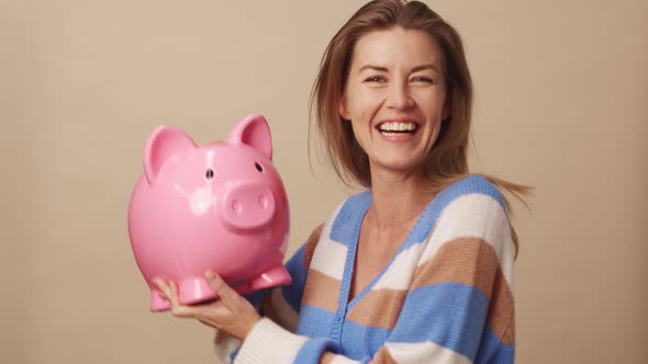 Woman Kissing Piggybank