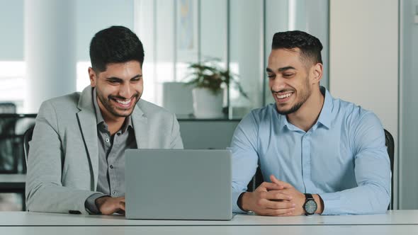 Cheerful Smiling Male Colleagues Employees Cooperating in Office Talking Working Together at