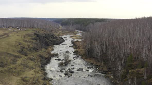 Aerial View of the River with Large Rocks in the Riverbed.