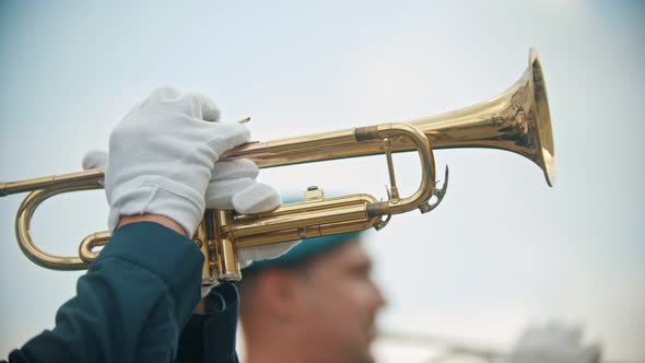 A Wind Instrument Military Parade - a Man Playing Trumpet Outdoors