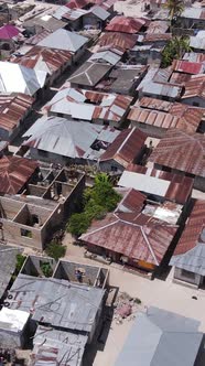 Zanzibar Tanzania  Aerial View of Houses Near the Coast Vertical Video