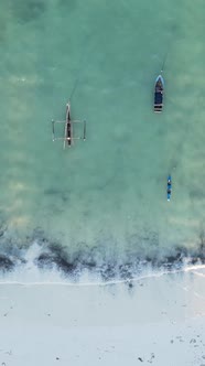 Vertical Video Boats in the Ocean Near the Coast of Zanzibar Tanzania