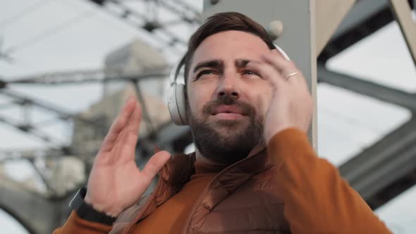 Man Listening to Music in Earphones