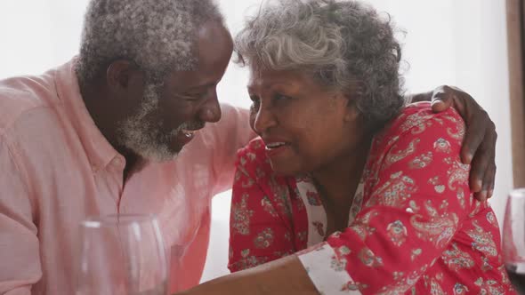 A senior african american couple spending time together at home social distancing in quarantine.