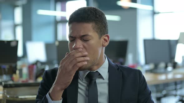 Portrait of African Businessman Yawning in Office