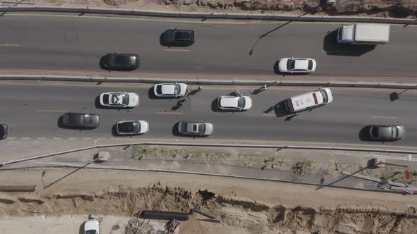 Ambulance making his way and arriving to a Car crash scene on a highway, Aerial follow footage.