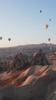 Vertical Video of Hot Air Balloons Flying in the Sky Over Cappadocia Turkey