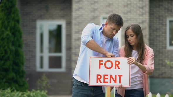 Couple Installing for Rent Signboard