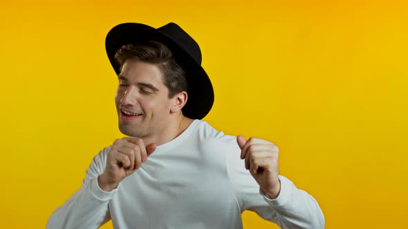 Happy European Hipster Man Dancing, Showing Yeah Gesture of Victory, He Achieved Result, Goals