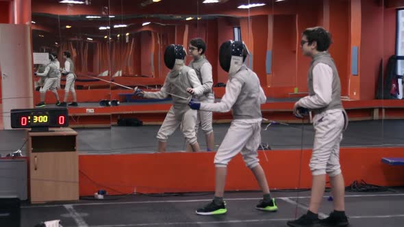 Kids practicing fencing at a fencing school
