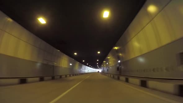 Car Driving Through The Tunnel From The Car Passenger Point Of View