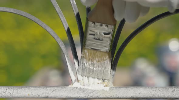 Painting rusty chair with protective anti-rust paint