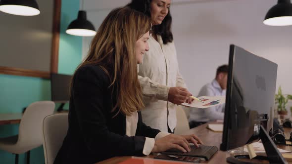 Business women working together in co-working creative space