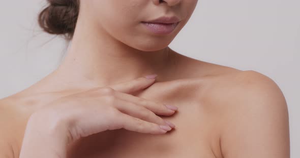 Asian Woman Touching Her Neckline, Close Up Beauty Portrait