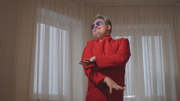 a Man in a Red Jacket Dancing