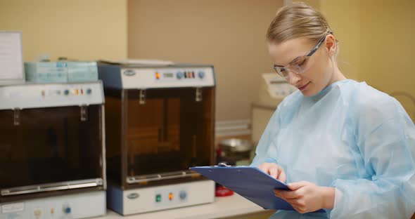 Female Scientist Working at Laboratory