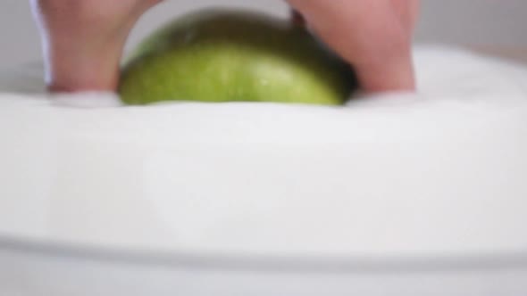 Putting a Green Apple Into the Milk