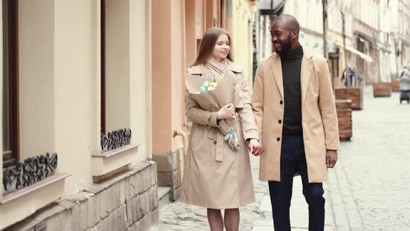 Multi Ethnic Couple Walking the Old City on Women's Day