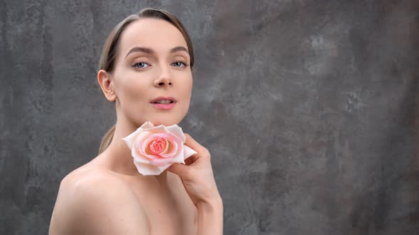 Beautiful Naked Young Girl Posing with Tender Rose