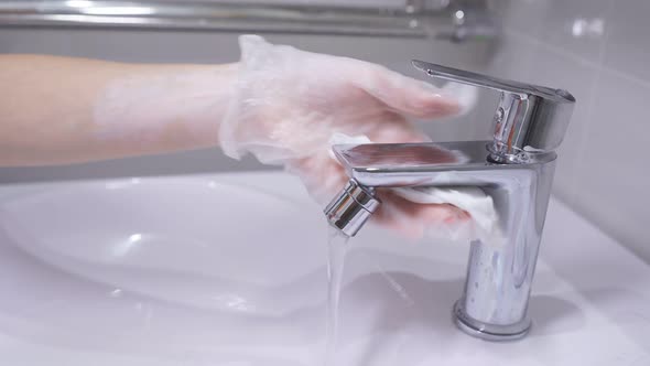 Faucet in the Bathroom Is Equipped with Household Chemicals, Sanitary Treatment and Disinfection of