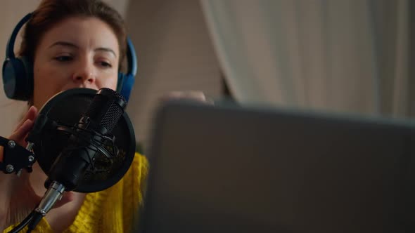 Woman Checking Sound Before Recording Podcast in Home Studio