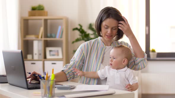 Working Mother with Baby Boy at Home Office 4