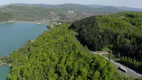 Mountain Road Through Dense Forest With View Of Maneciu Reservoir In Prahova County, Muntenia, Roman